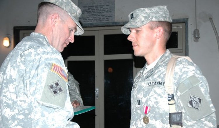 Bryan Erickson receiving a medal