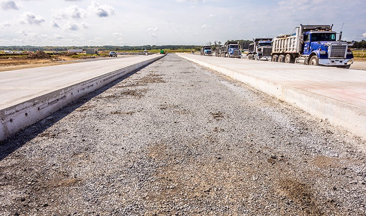 airfield paving trucks concrete
