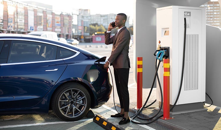 electric vehicle man charging