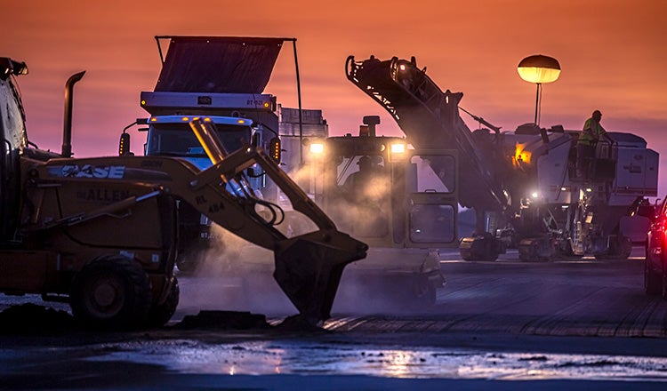 Blue Grass Airport work trucks silhouette