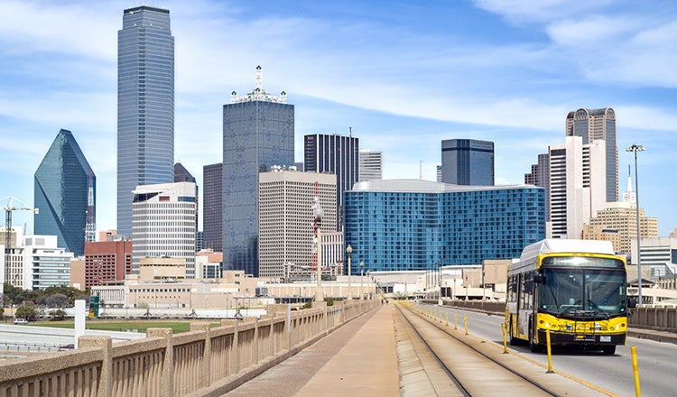 Bus with downtown dallas skyline