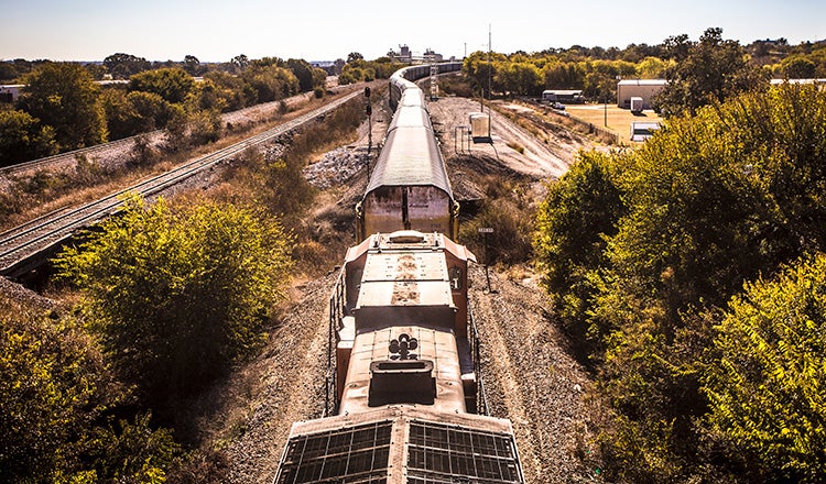 freight rail train stretching into distance