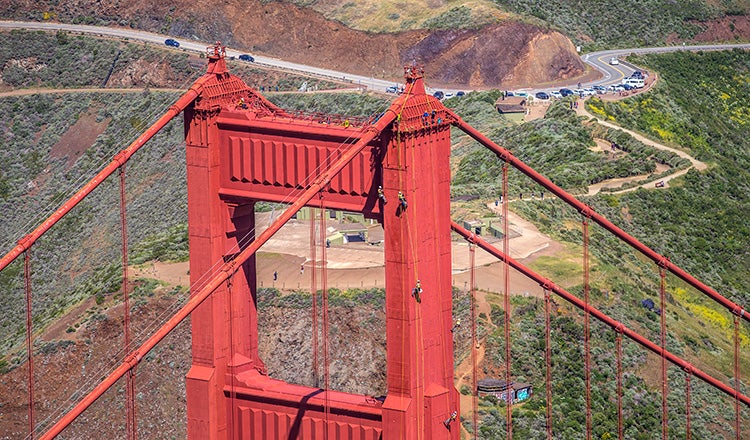 Inspectors on ropes at Golden Gate Bridge