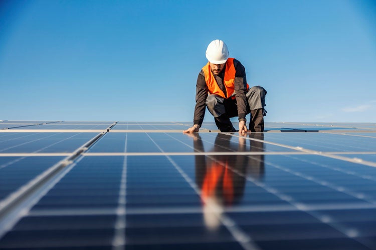 person on a solar panel