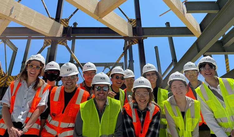 group picture of teammates wearing hard hats