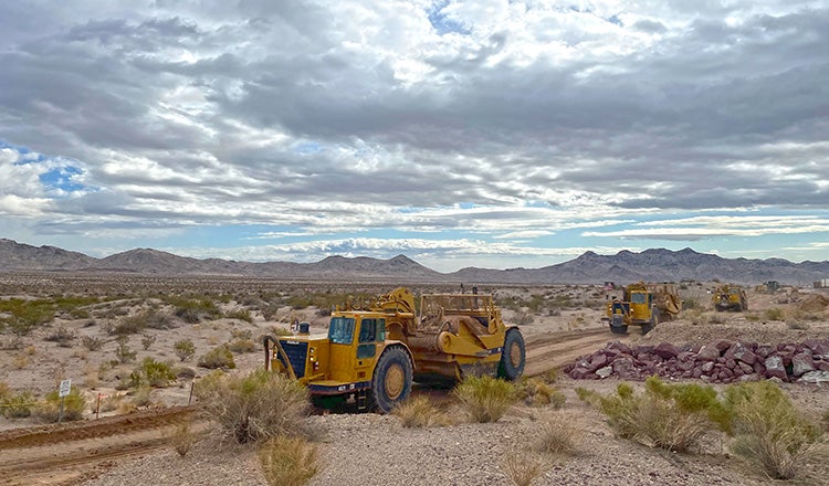 construction vehicles working in desert