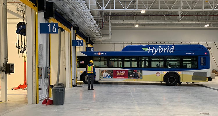 Hybrid fuel bus in garage