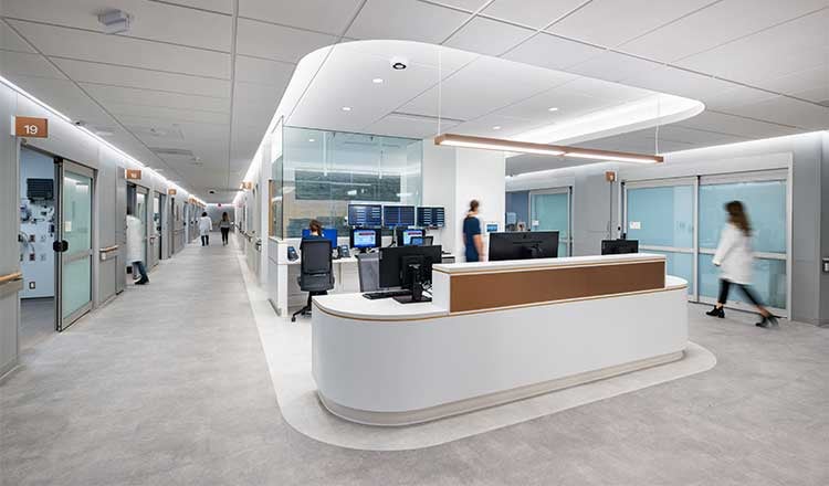 Hosital Ward at Univerity of Pennsylvania, The Pavillion. Desk reception area at the front looking down corridor.