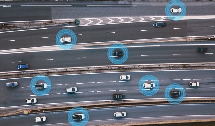 overhead view of vehicles on highway with blue circles representing sensors
