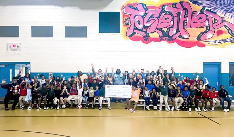 Members of the Boys and Girls Clubs of Northeast Florida celebrate an HDR Foundation grant to renovate the club's Project Learn space.
