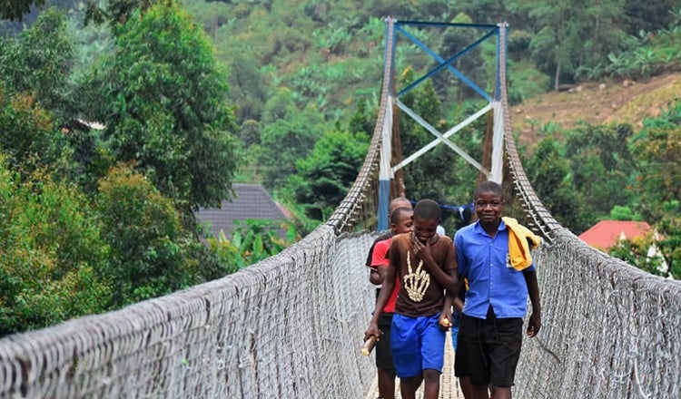 children crossing pedestrian suspension bridge