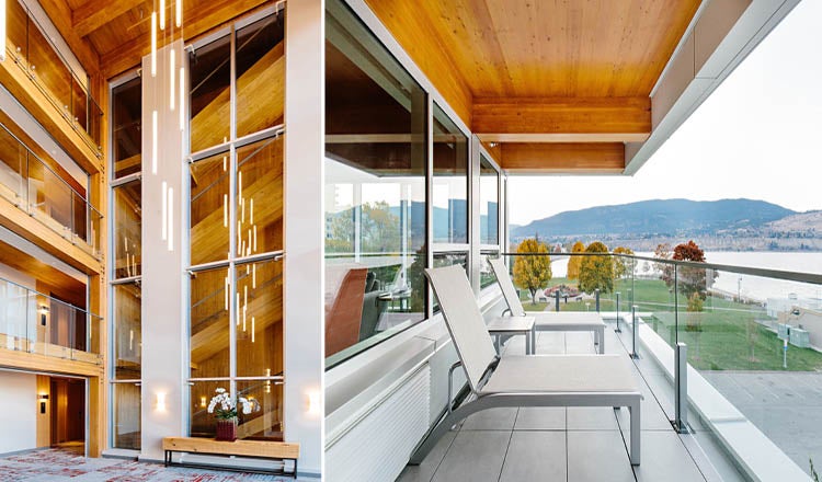 Two images of a mass timber hotel, left showing modern light fixtures, right side is outdoors