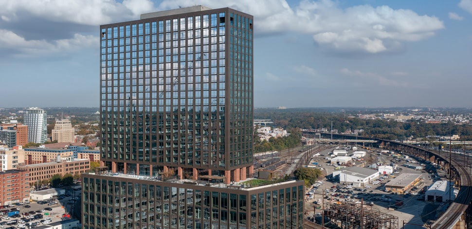 Aerial view of glass building, city surrounding