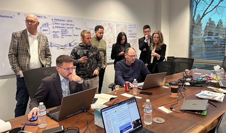 eight team members collaborating in a conference room