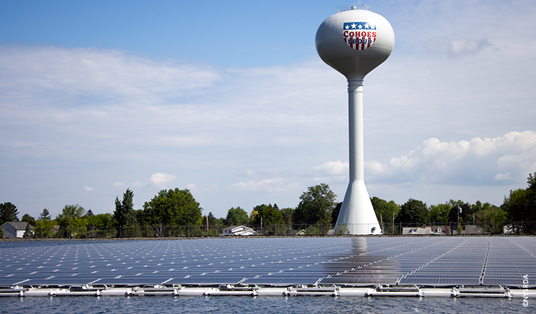 Water tower overlooking solar panels