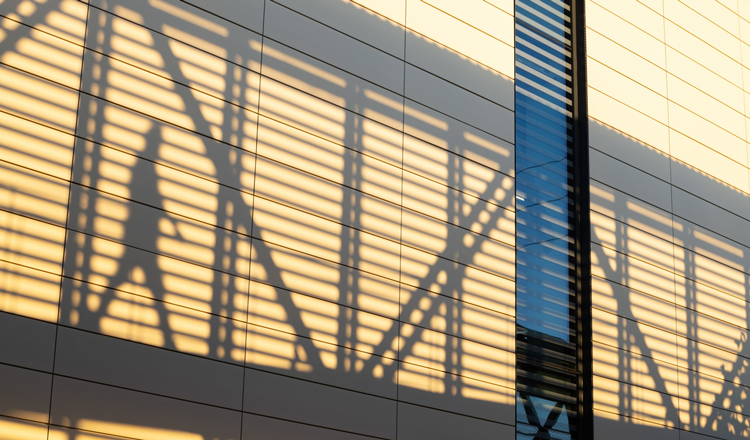 shadow of man and pedestrian bridge at the orange county sanitation district headquarters complex