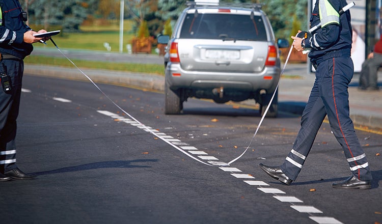 police officers investigating at crash scene