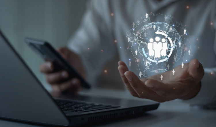 Man working from a laptop and a smartphone.