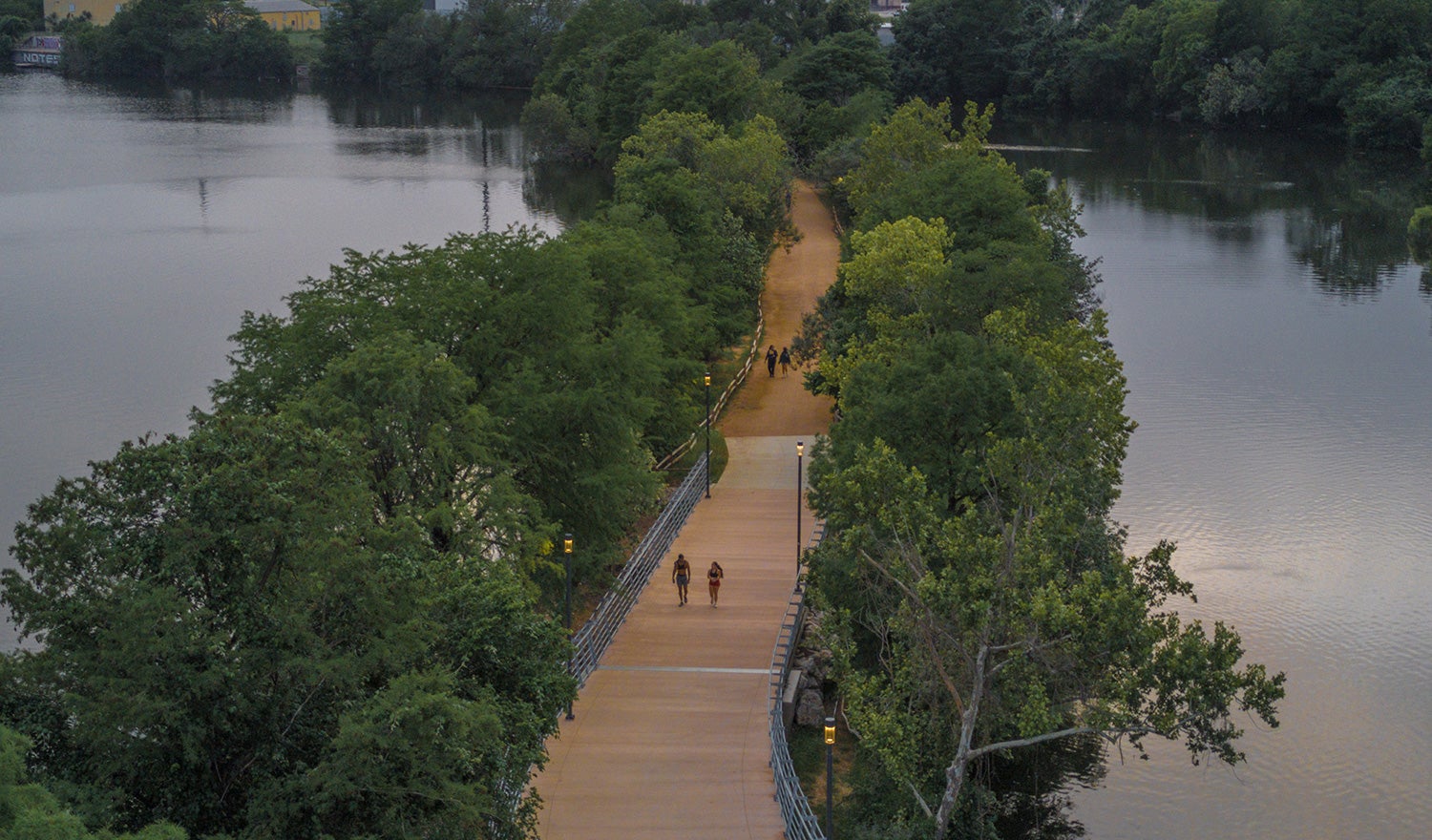 People walking on the Wishbone Bridge in Austin, Texas