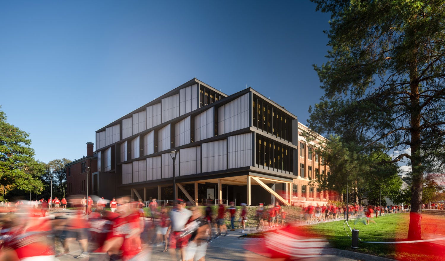 Exterior of UNL College of Architecture HDR Pavilion, with students outside