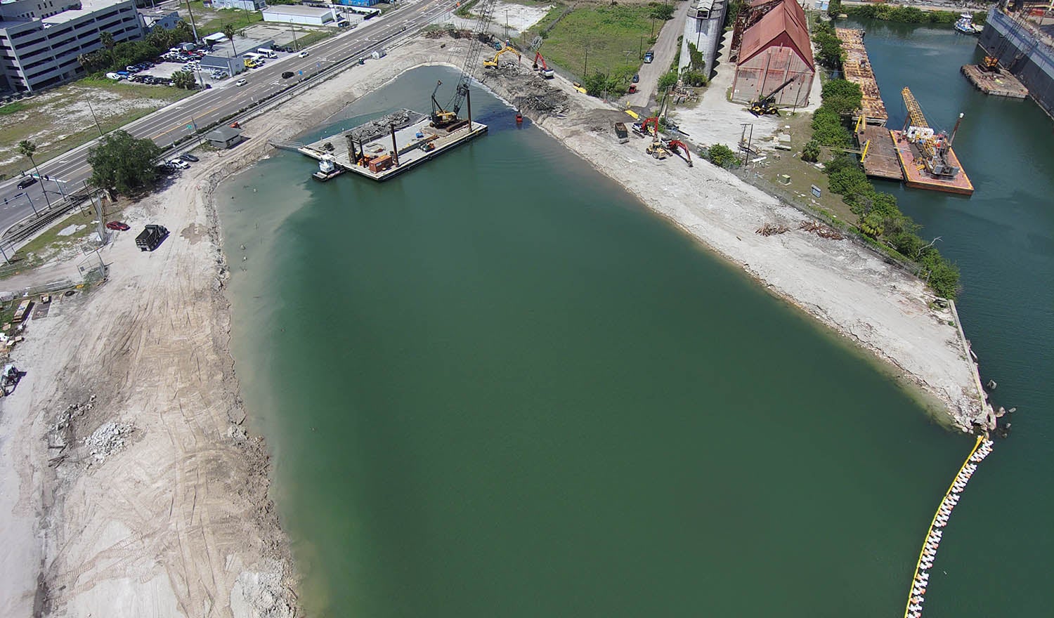 marine slip of water surrounded by sand