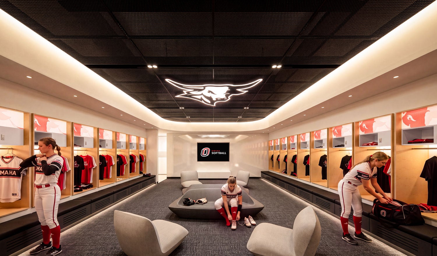Rendering of two student athletes in a softball locker room at the University of Nebraska athletics clubhouse
