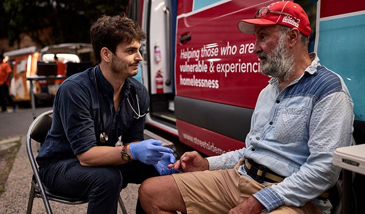 A medic helps a community member