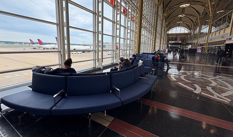 blue bench seating at airport
